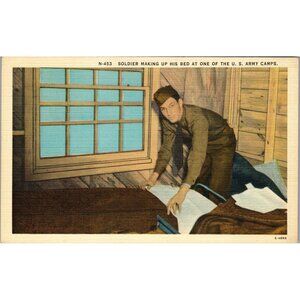 Post Card,Soldier Making Up his bed at one of the US Army Camps WWII era(PC51)